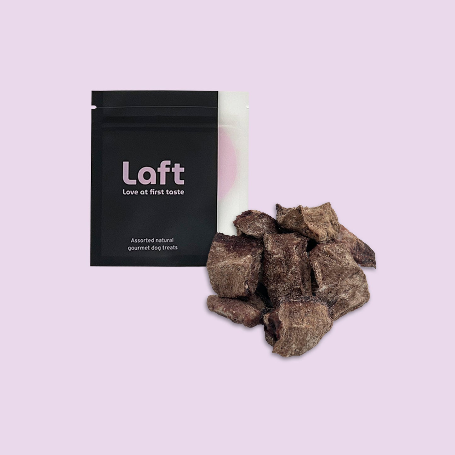 A black Laft Pet treat pouch placed next to a pile of freeze-dried beef heart dog treats on a light purple background.