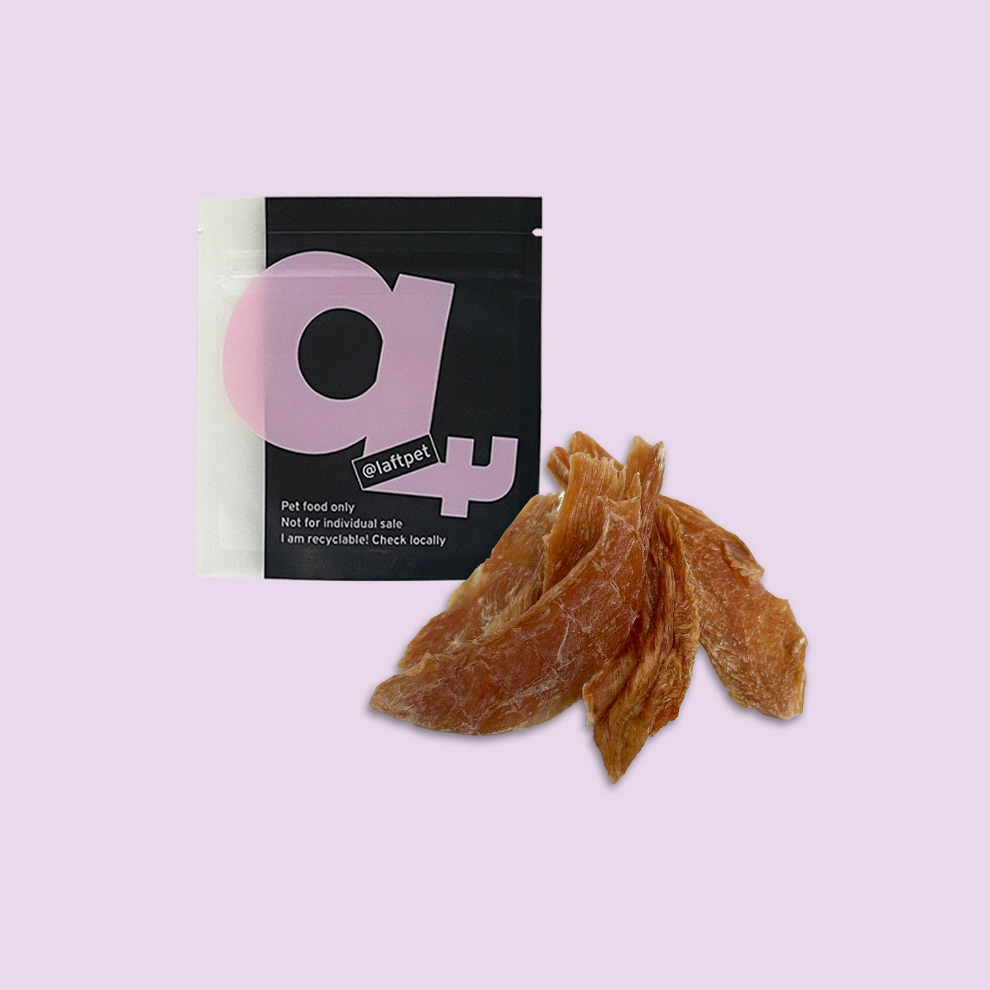 A black Laft Pet treat pouch placed next to a pile of dehydrated chicken jerky dog treats on a light purple background.