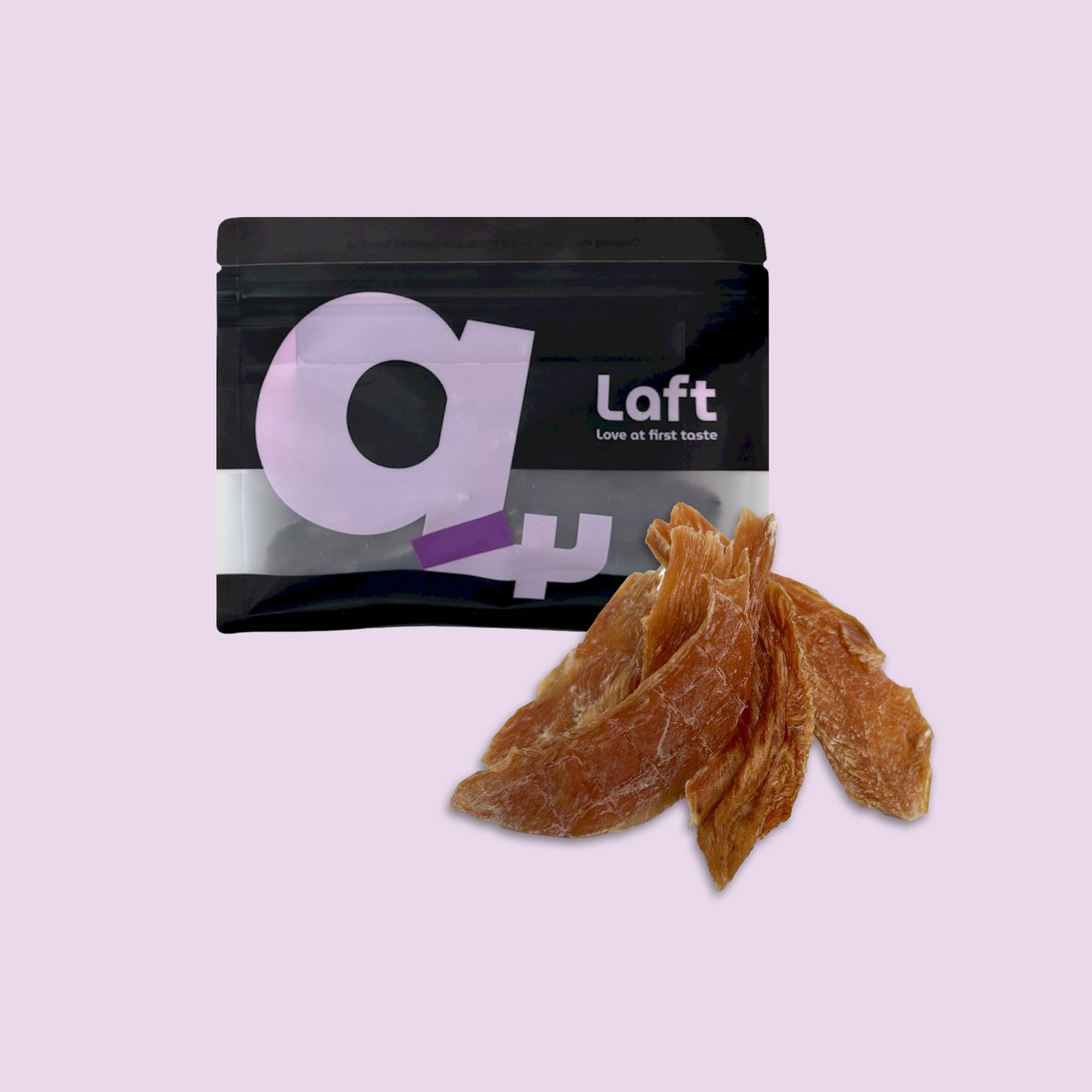 A black Laft Pet natural dog treat pouch placed next to a pile of dehydrated chicken jerky dog treats on a light purple background.