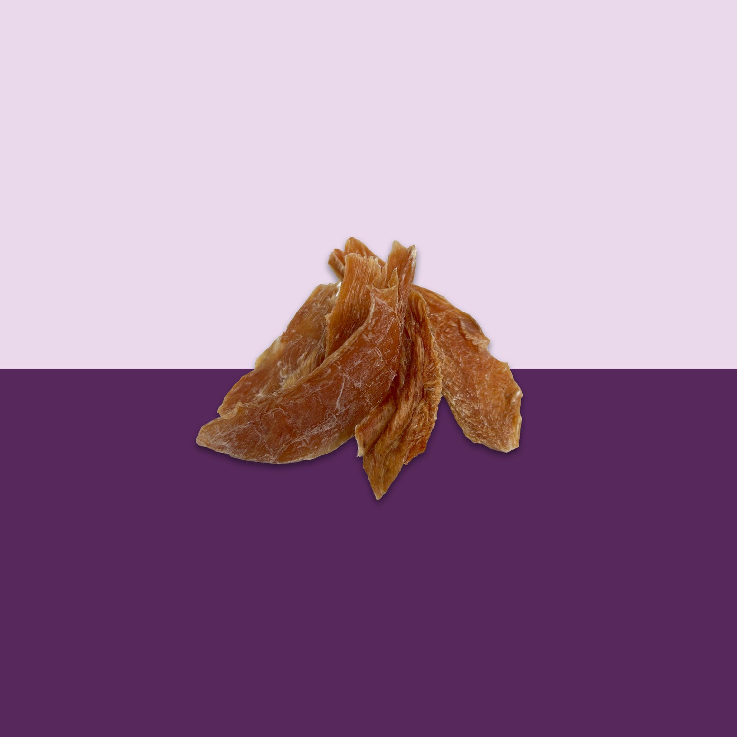 A clear image of tasty dog treats made with chicken jerky.